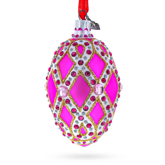 a pink and gold decorated christmas ornament
