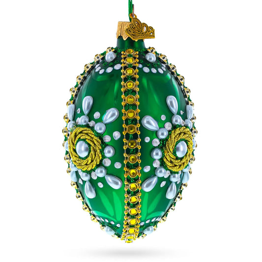 a green and gold decorated christmas ornament