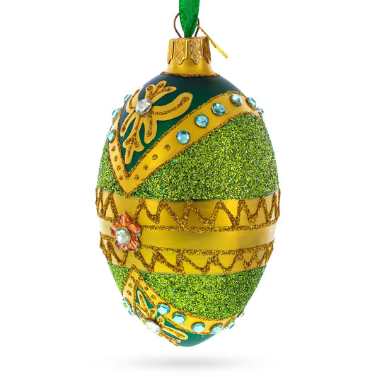 a green and gold decorated egg