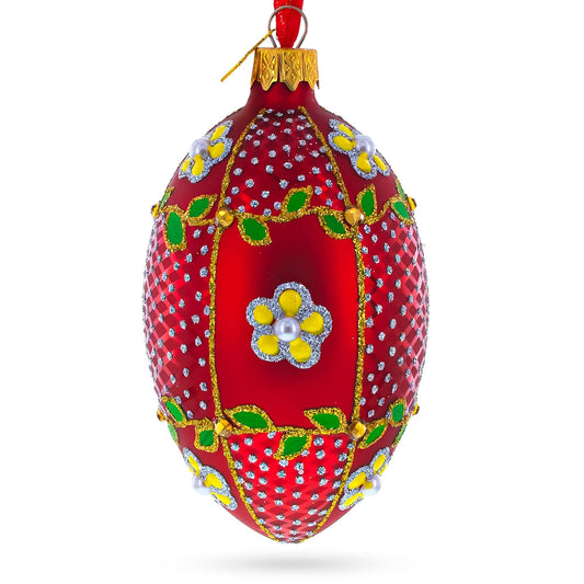 a red and gold decorated christmas ornament