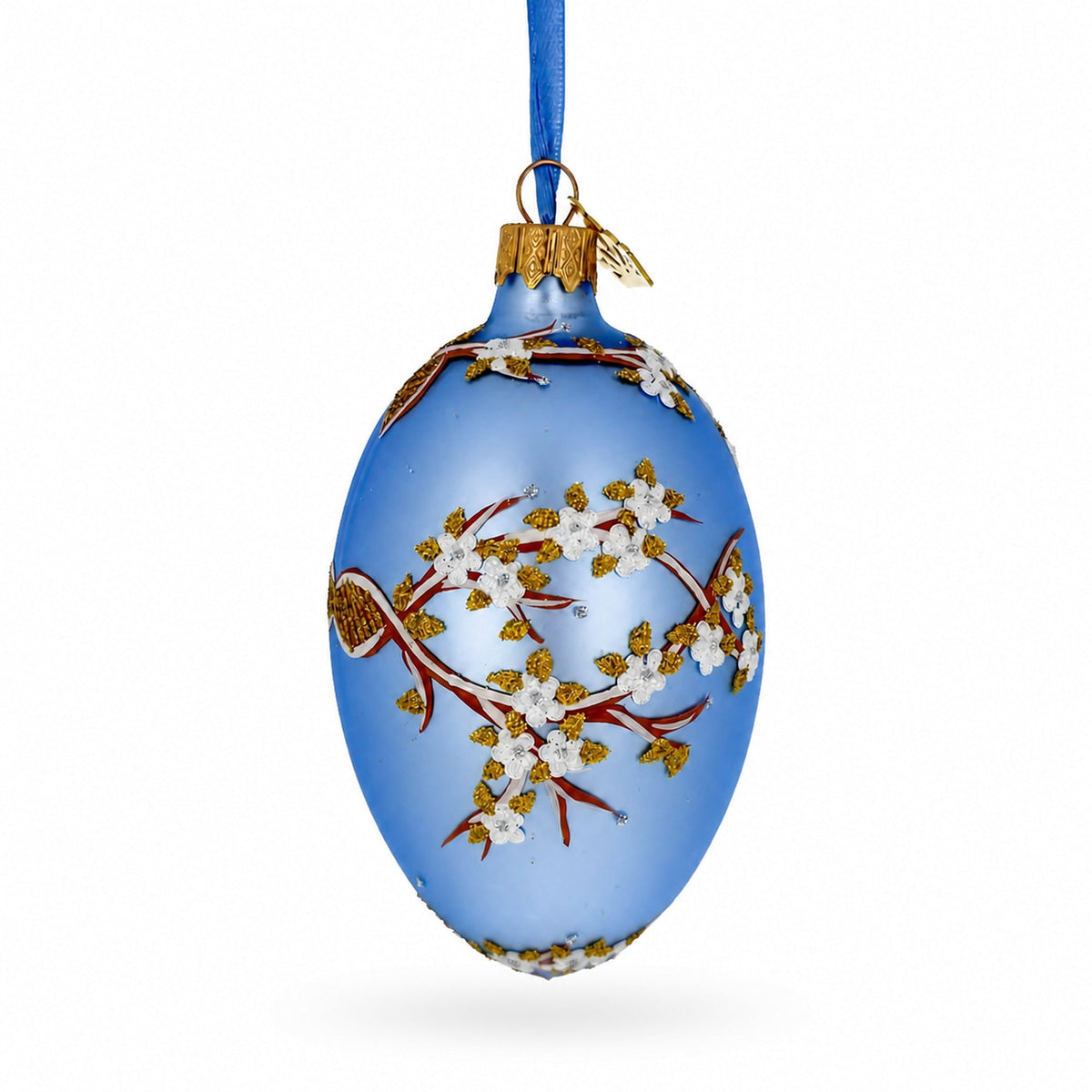 White Blossom Branch on Light Blue Glass Egg Ornament