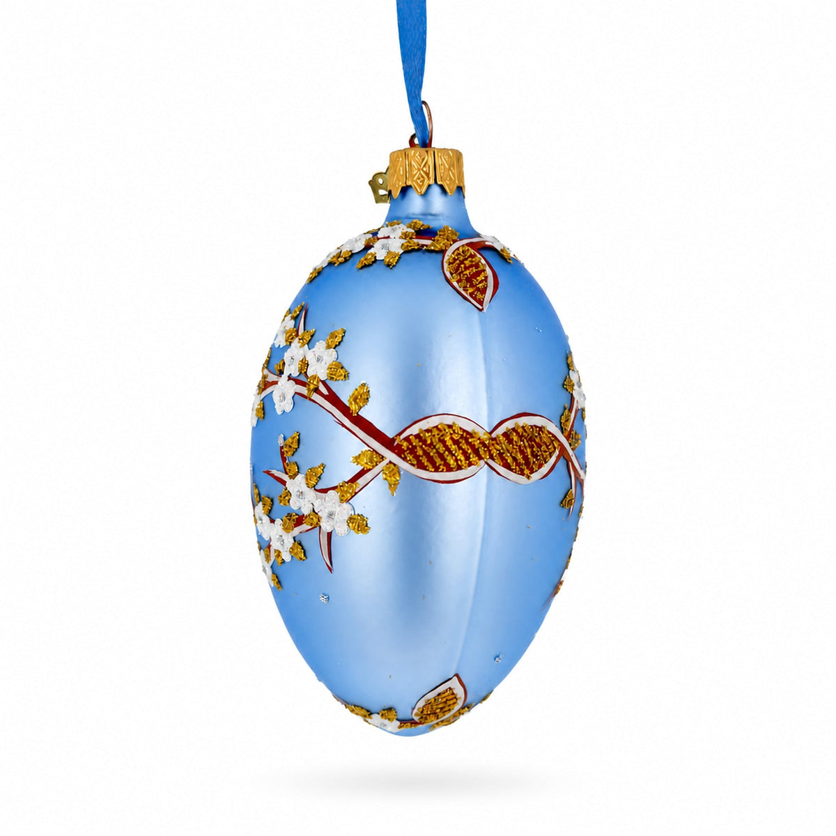 White Blossom Branch on Light Blue Glass Egg Ornament