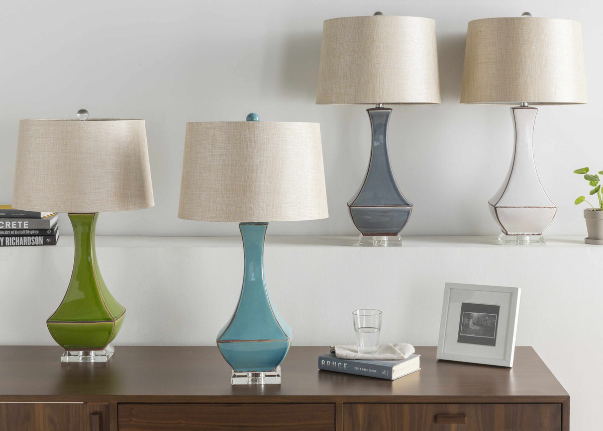 a group of lamps on a shelf