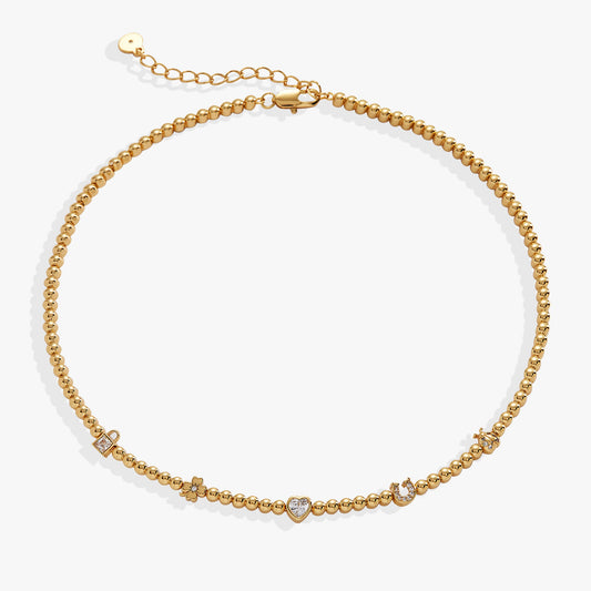 a gold beaded bracelet with diamonds