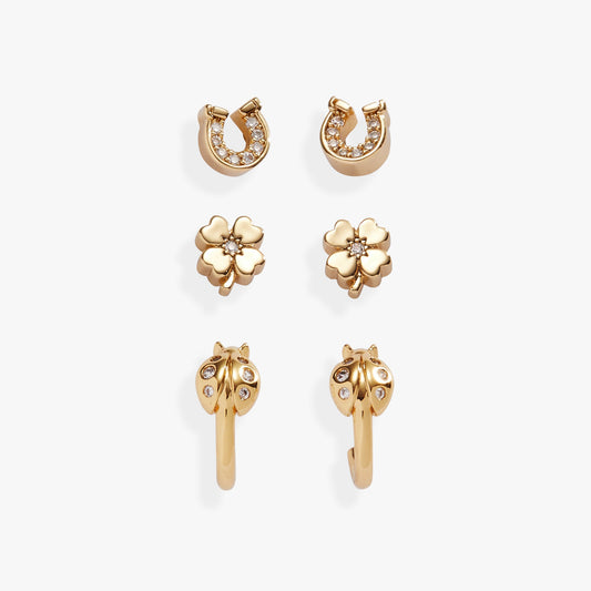 a group of gold earrings with diamonds