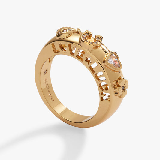 a gold ring with words and a heart