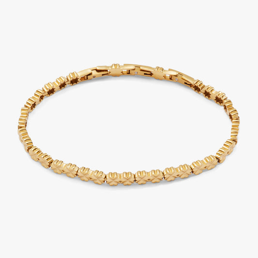 a gold bracelet with small flowers