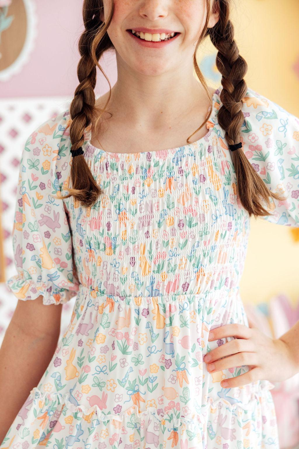 a girl with braids in a dress