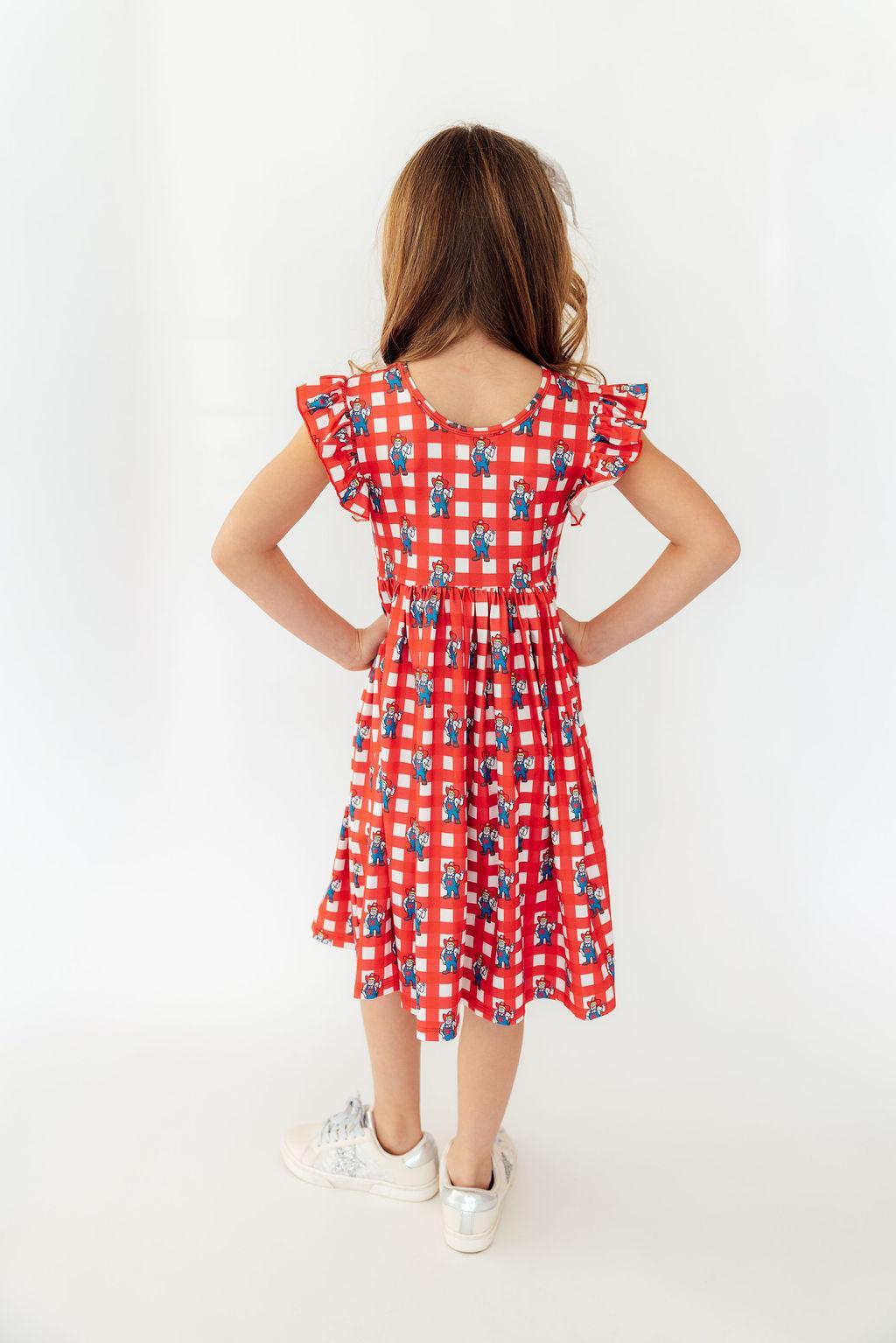 a girl in a red dress