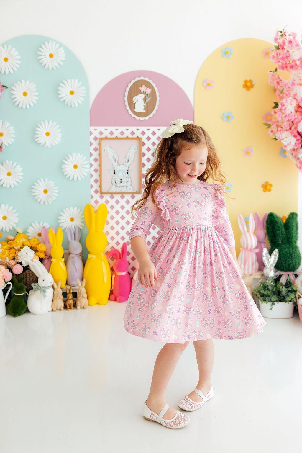 a girl in a pink dress