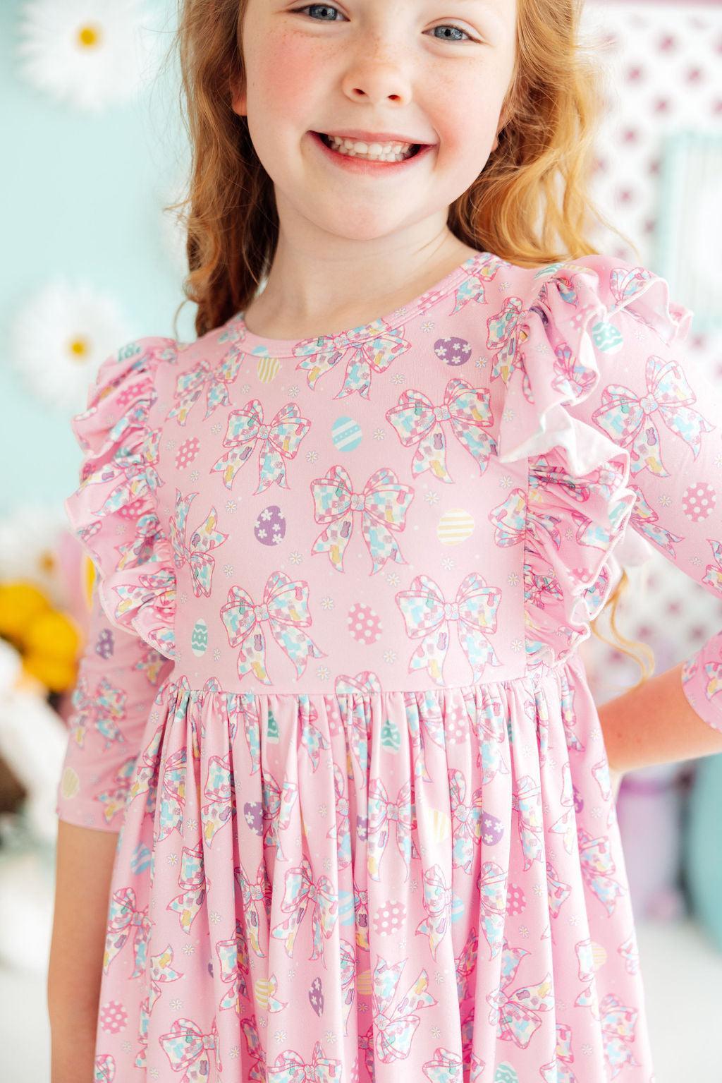 a girl in a pink dress