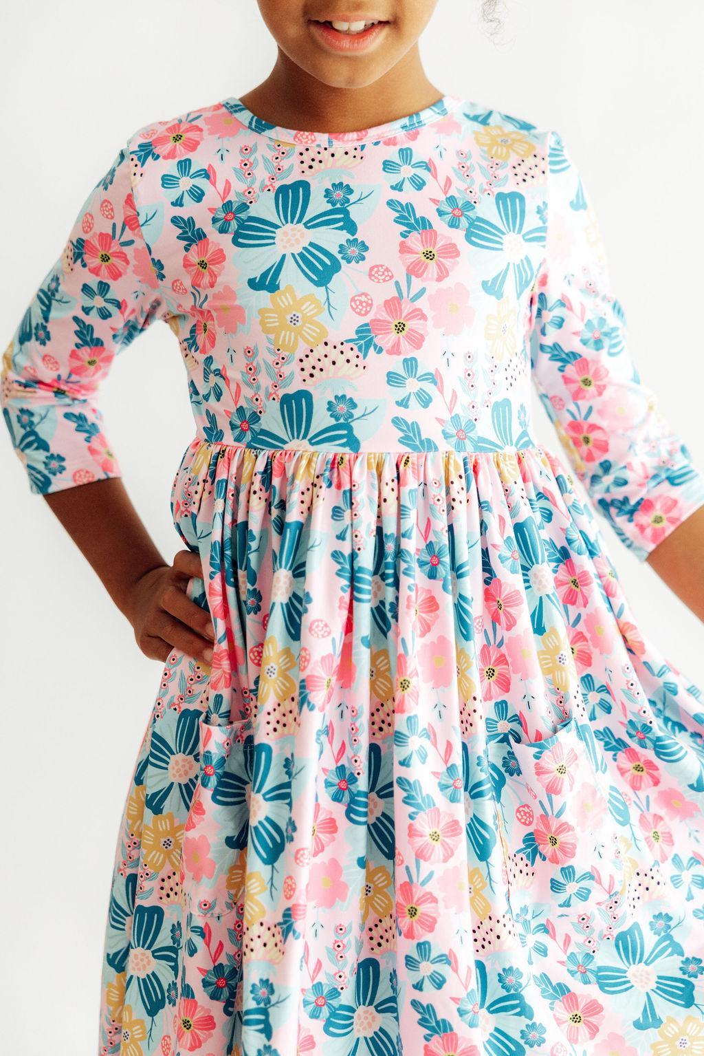 a girl wearing a floral dress
