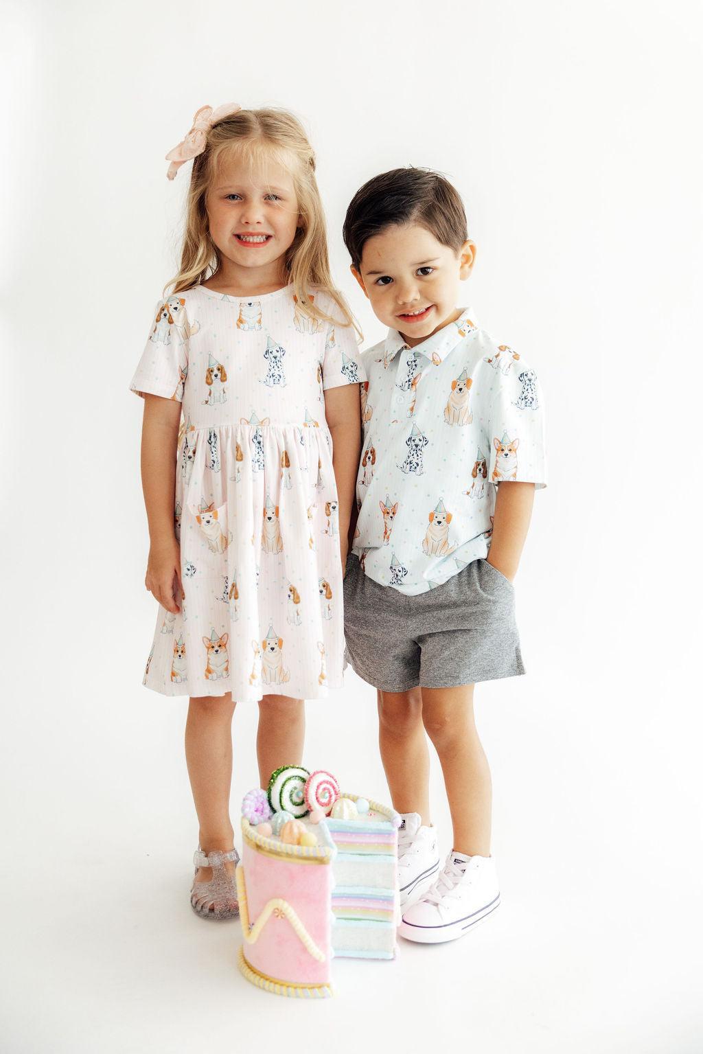 a boy and girl posing for a picture