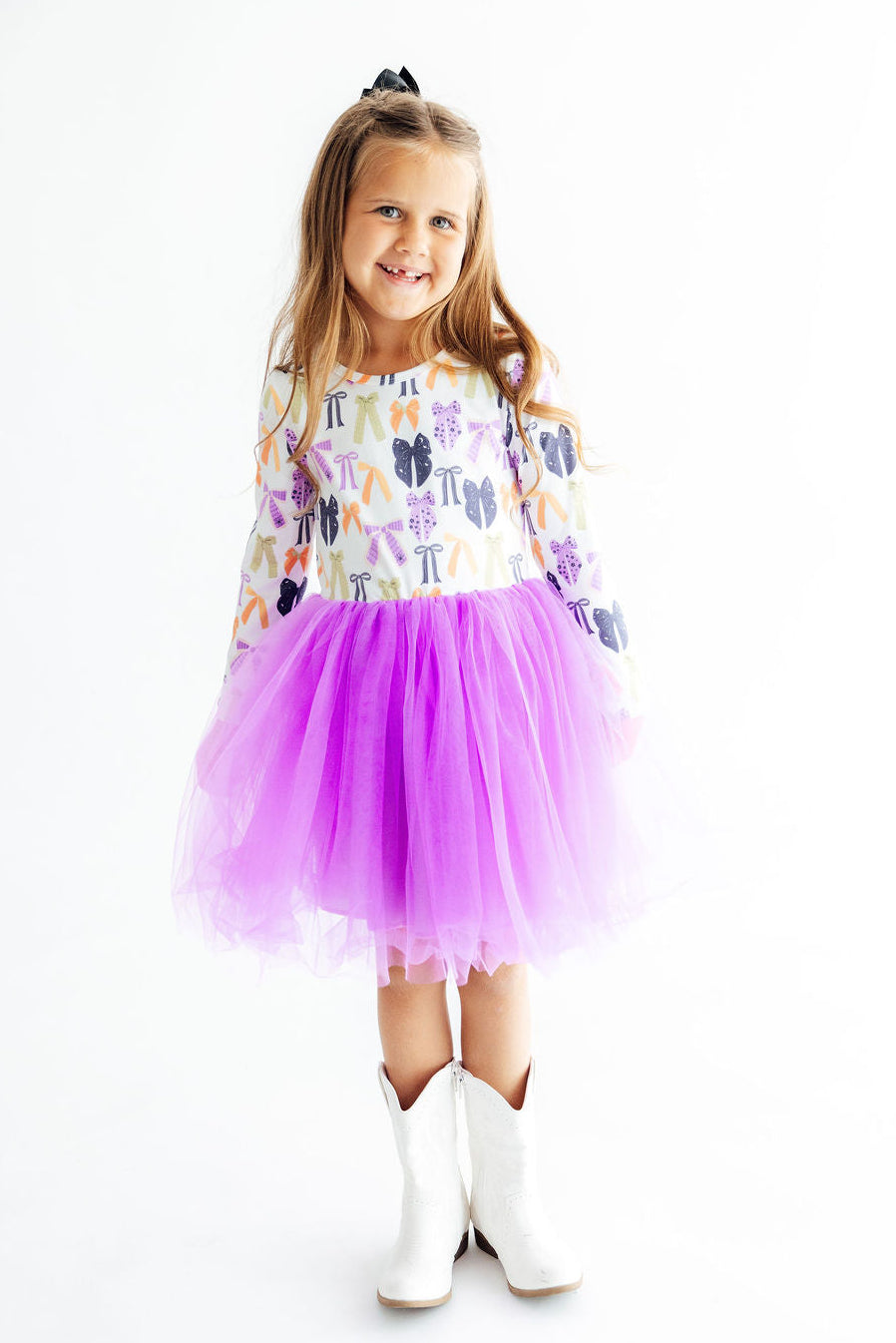 a girl in a tutu and boots