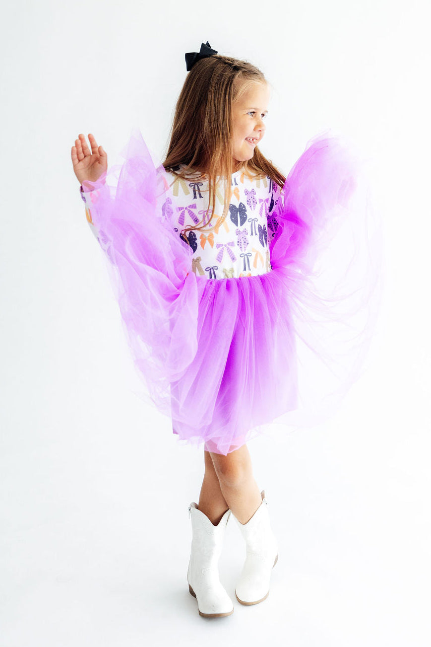 a girl in a tutu and boots