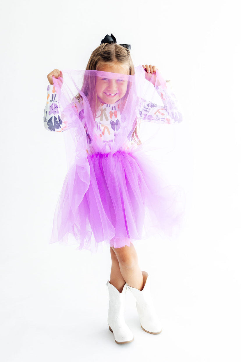 a girl in a tutu and boots