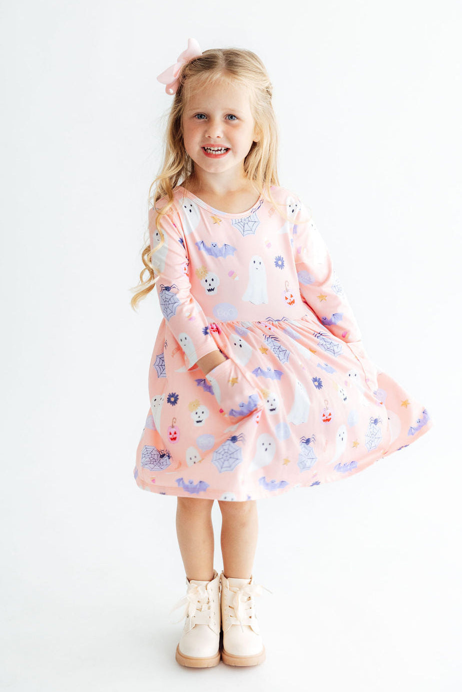 a girl in a pink dress