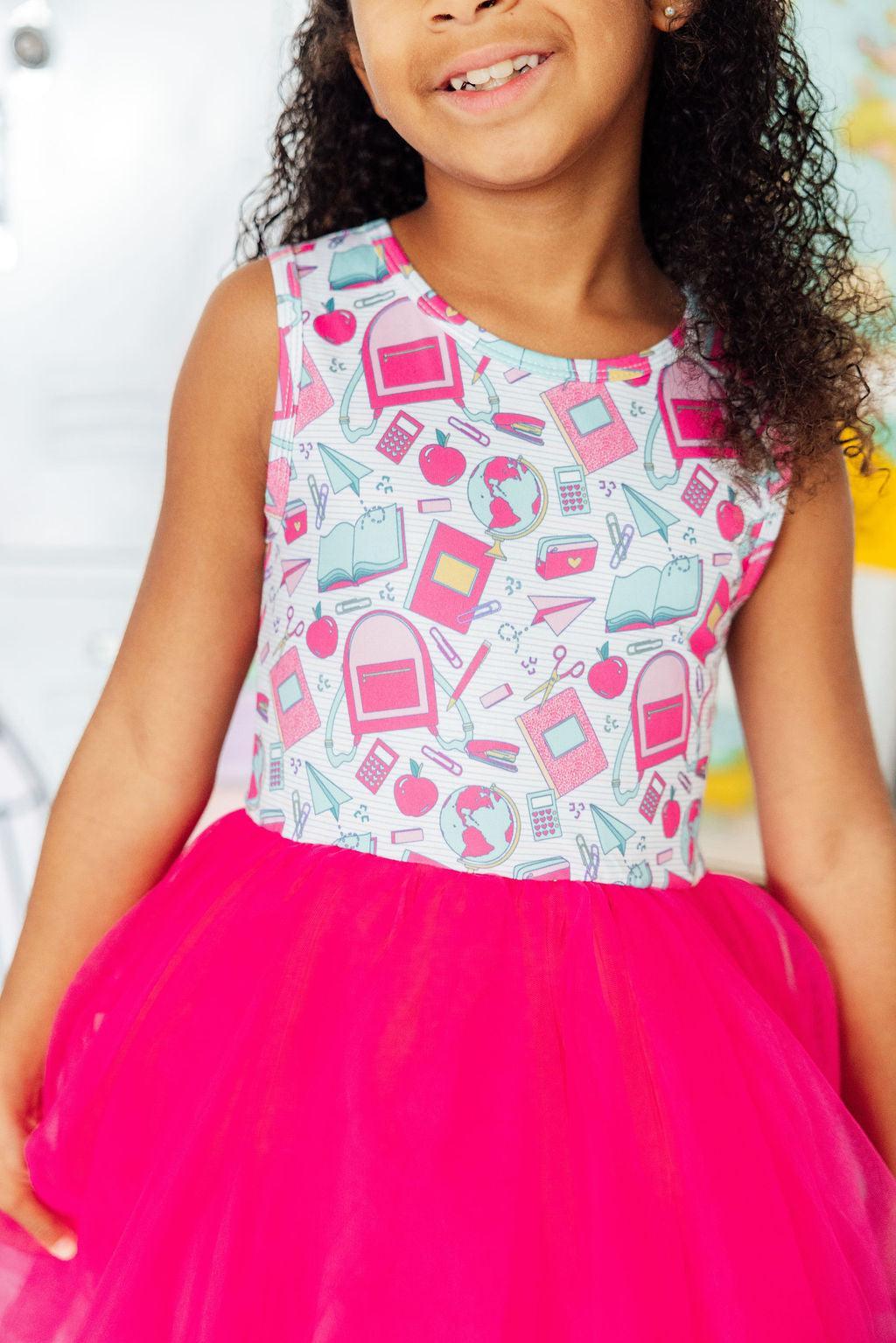 a girl in a pink dress