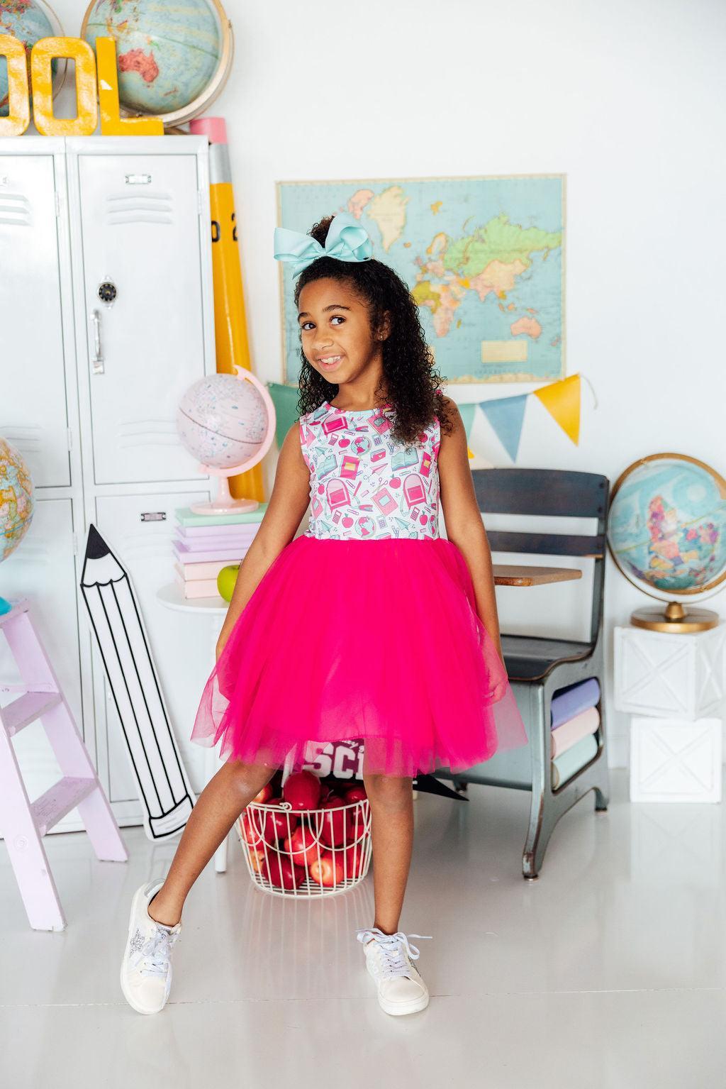 a girl in a pink dress