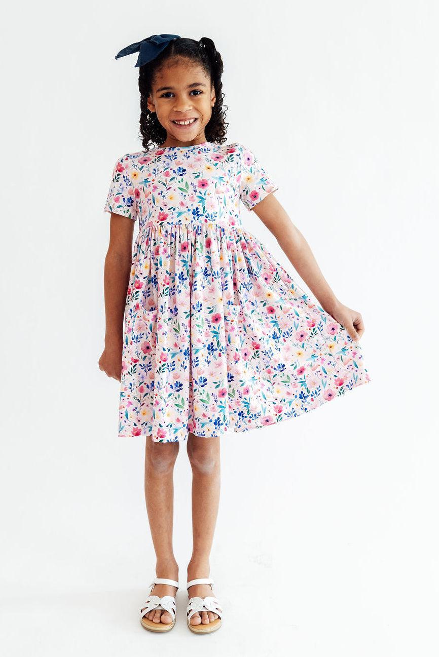 a girl in a dress