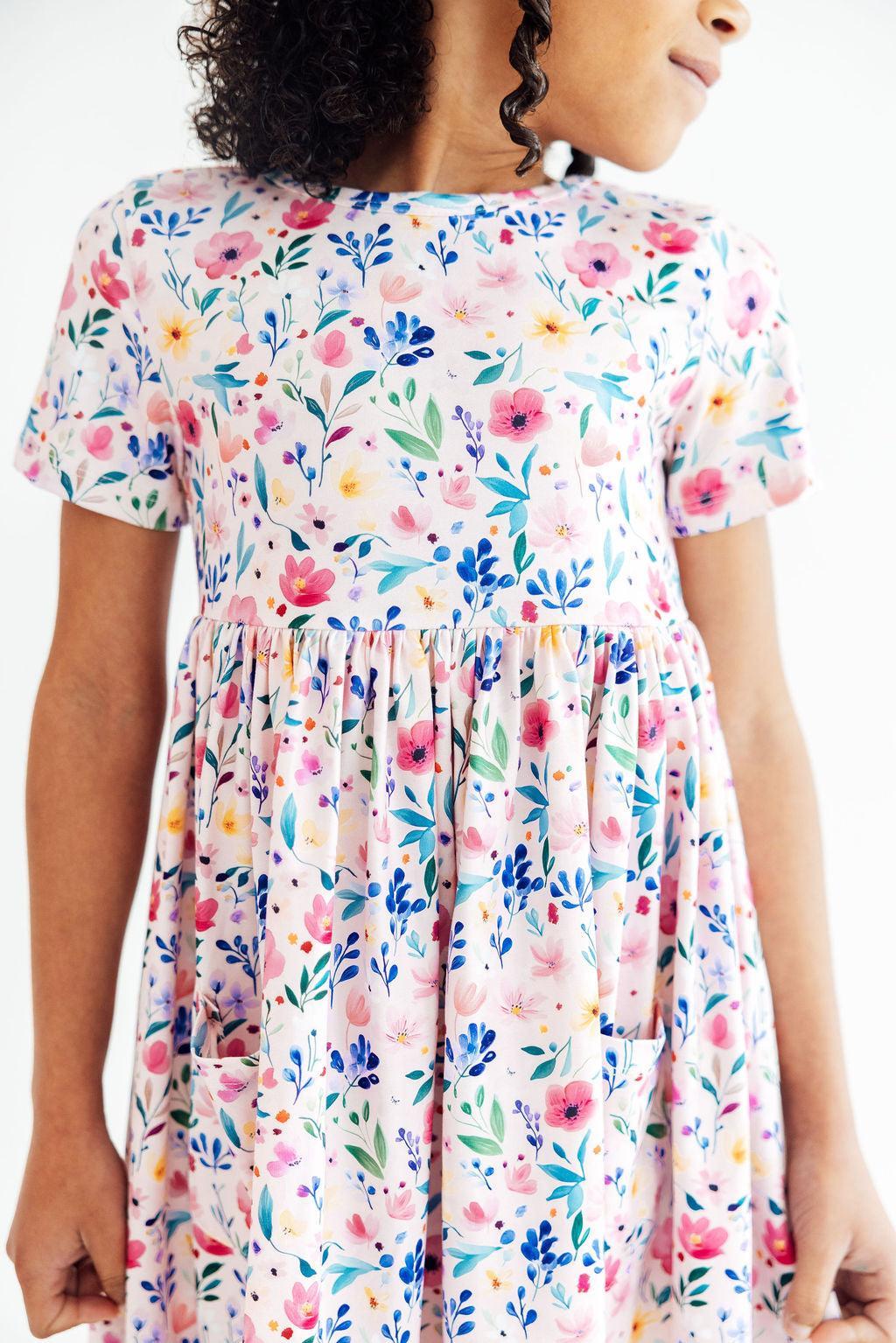 a woman wearing a floral dress