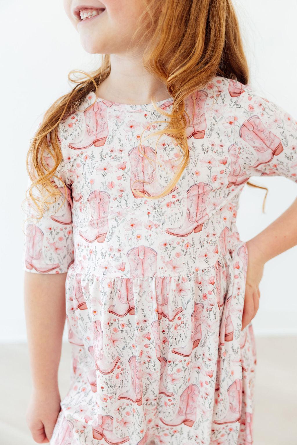 a girl with long hair wearing a dress