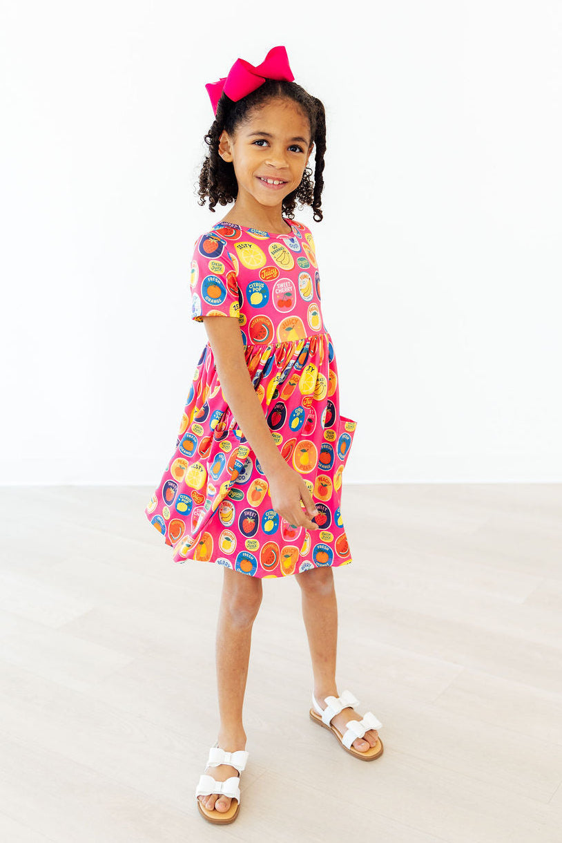 a girl in a pink dress