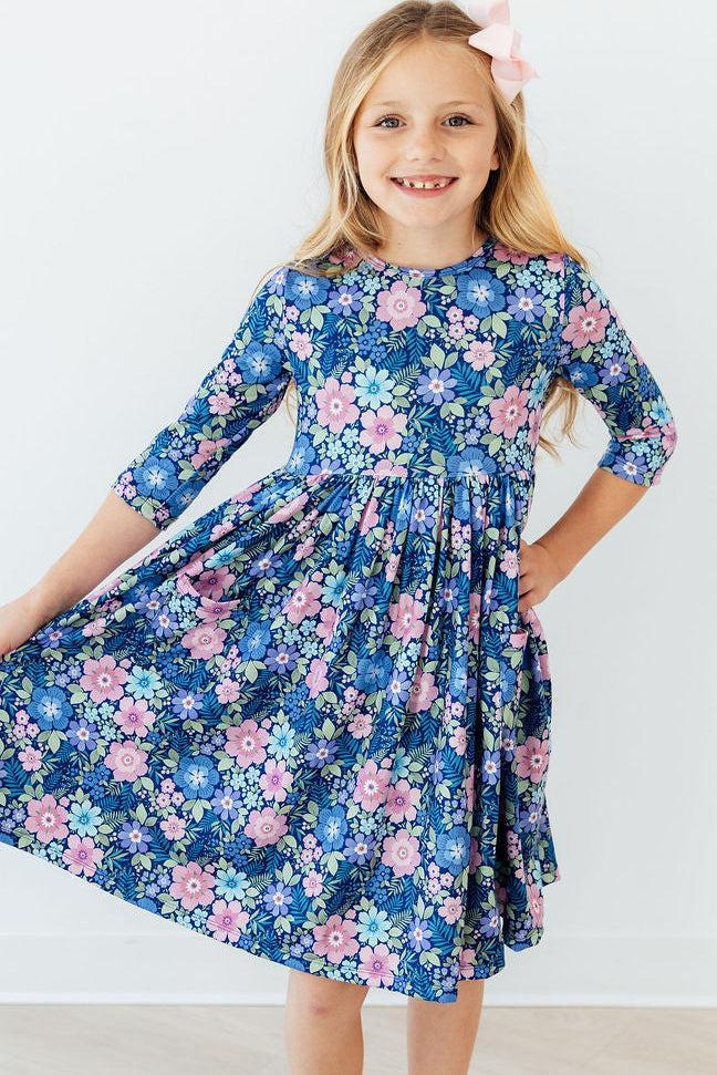 a girl in a floral dress