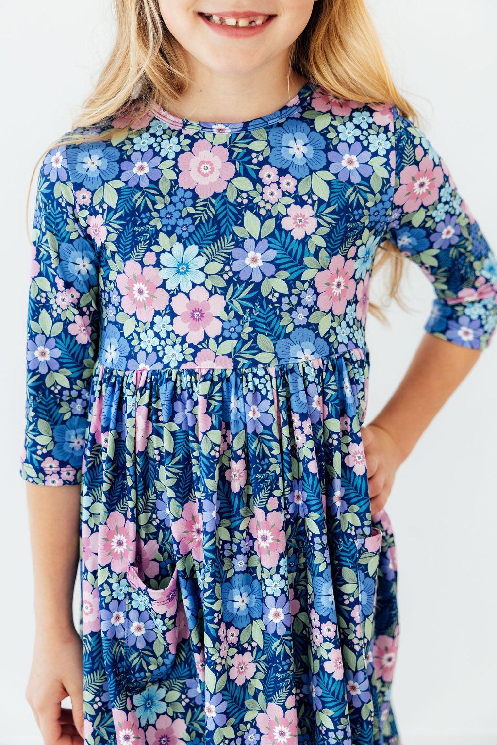 a girl wearing a floral dress