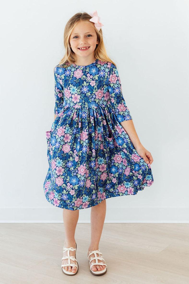 a girl in a blue dress