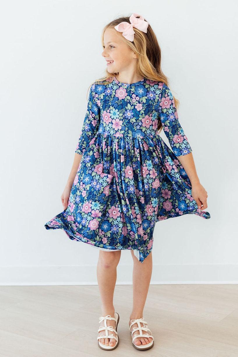 a girl in a blue dress