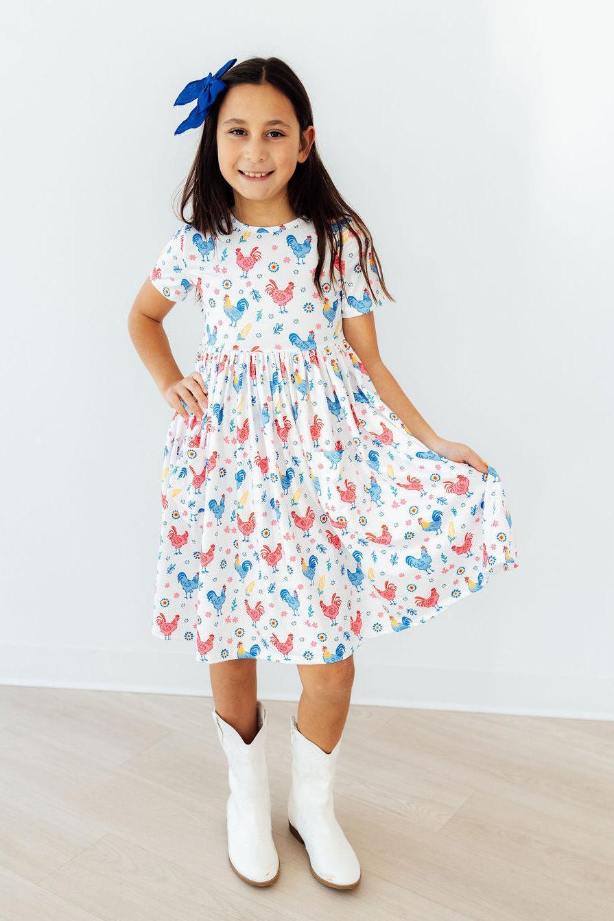 a girl in a dress and boots