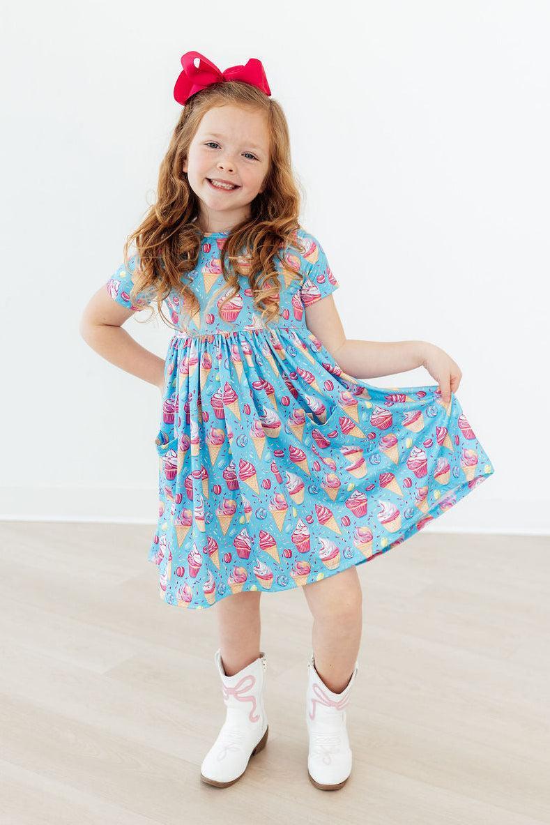 a girl in a blue dress
