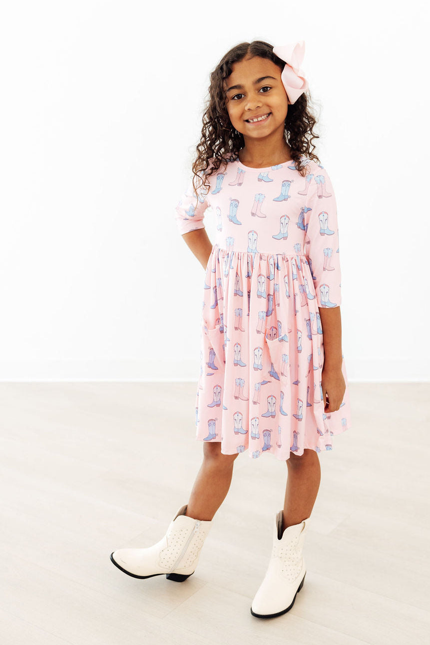 a girl in a pink dress