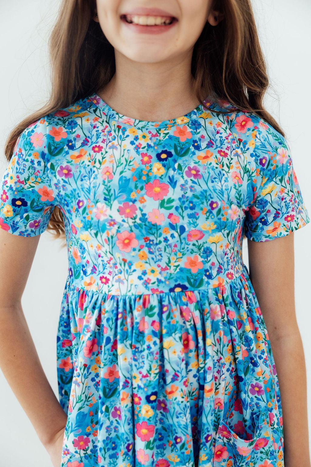 a girl wearing a floral dress