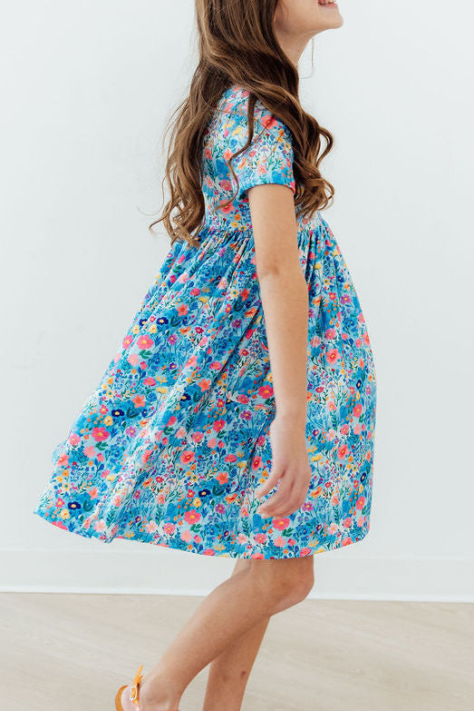 a girl in a floral dress