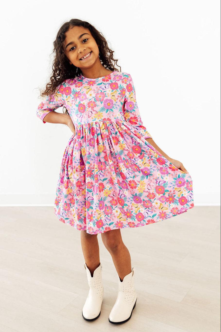 a girl in a pink dress