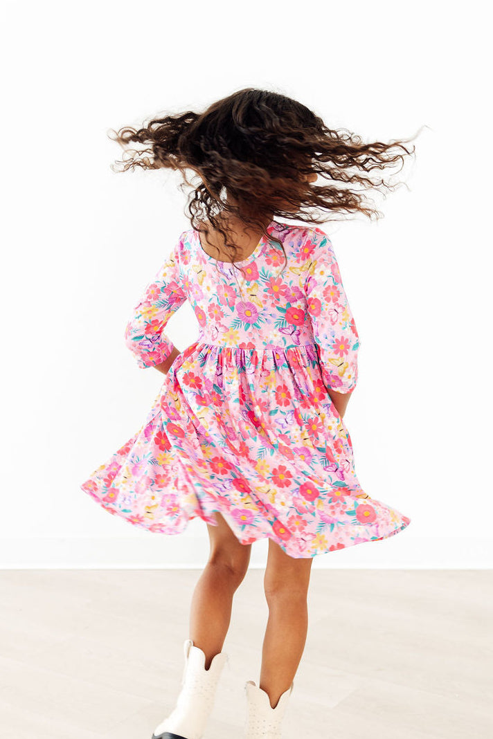 a girl in a pink dress