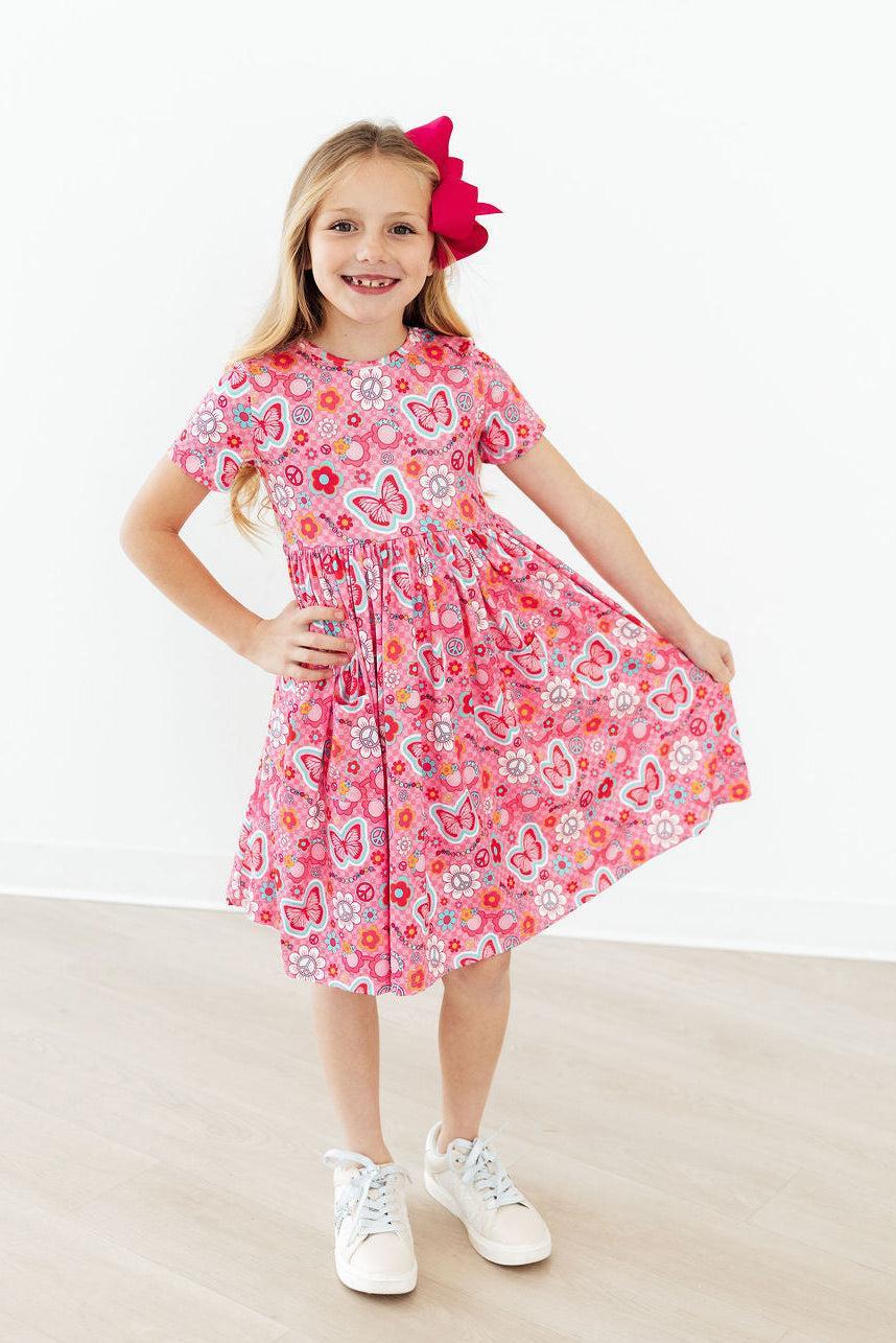 a girl in a pink dress