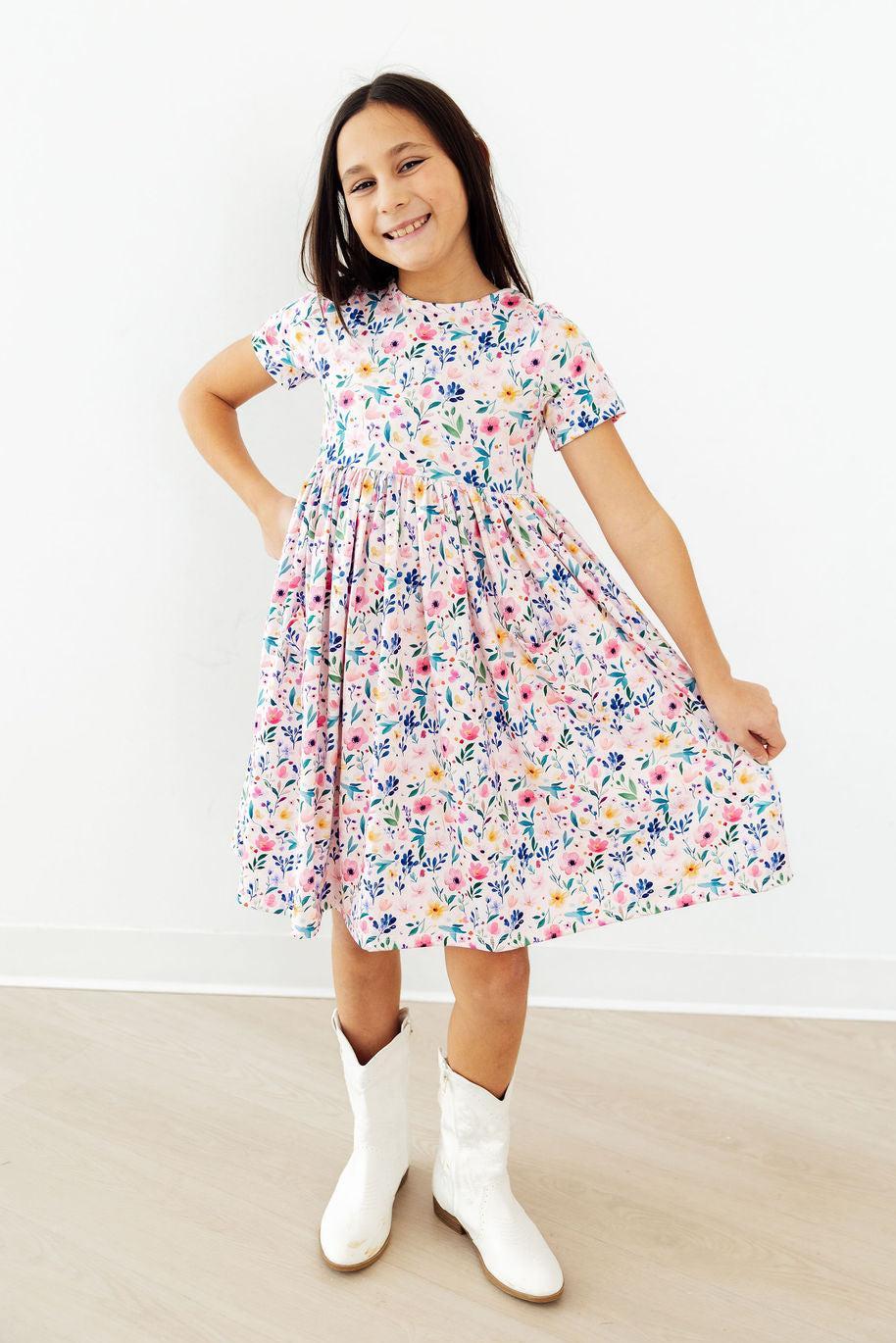 a girl in a dress and boots