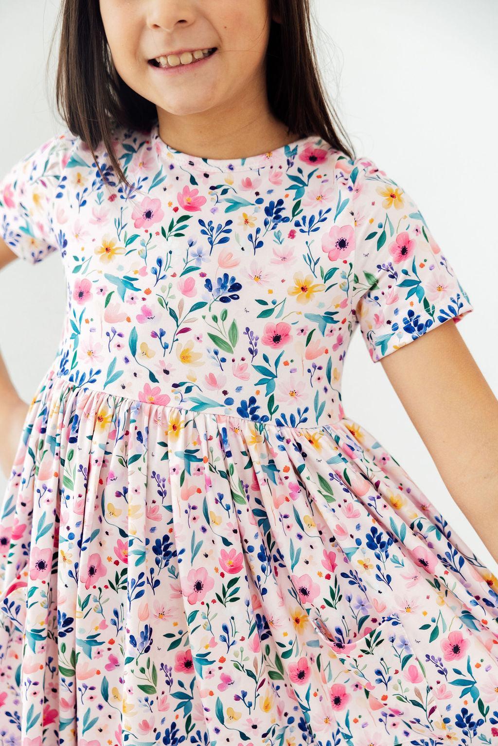 a girl wearing a floral dress