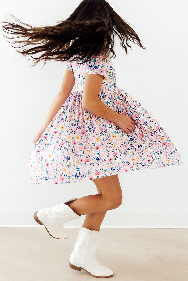 a girl in a dress and boots