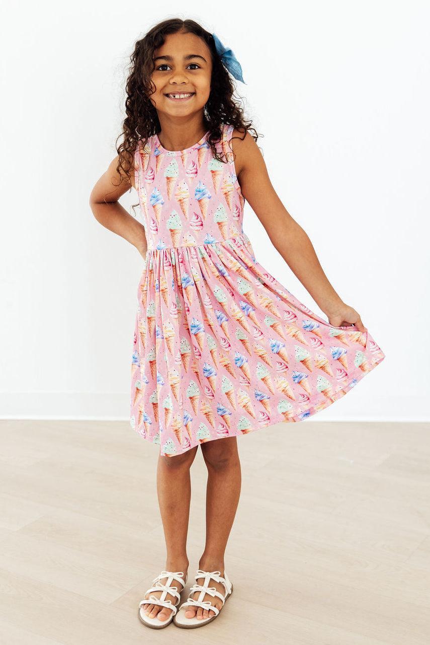 a girl in a pink dress