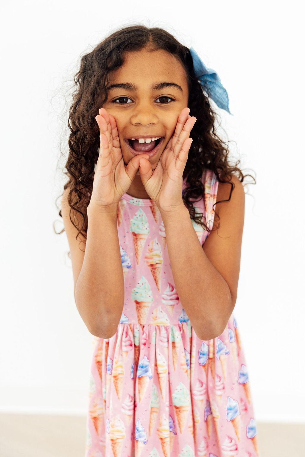 a girl with her hands on her face