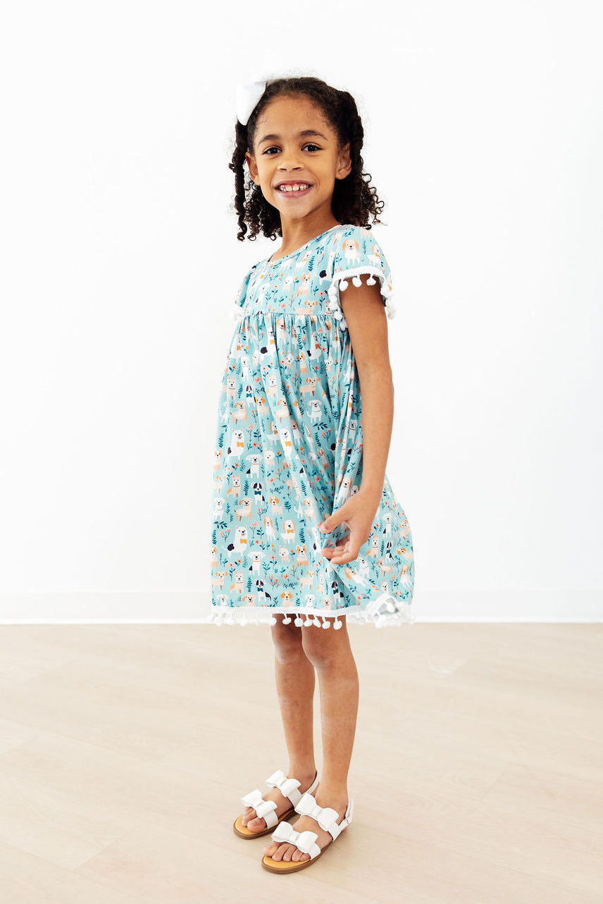 a girl in a blue dress