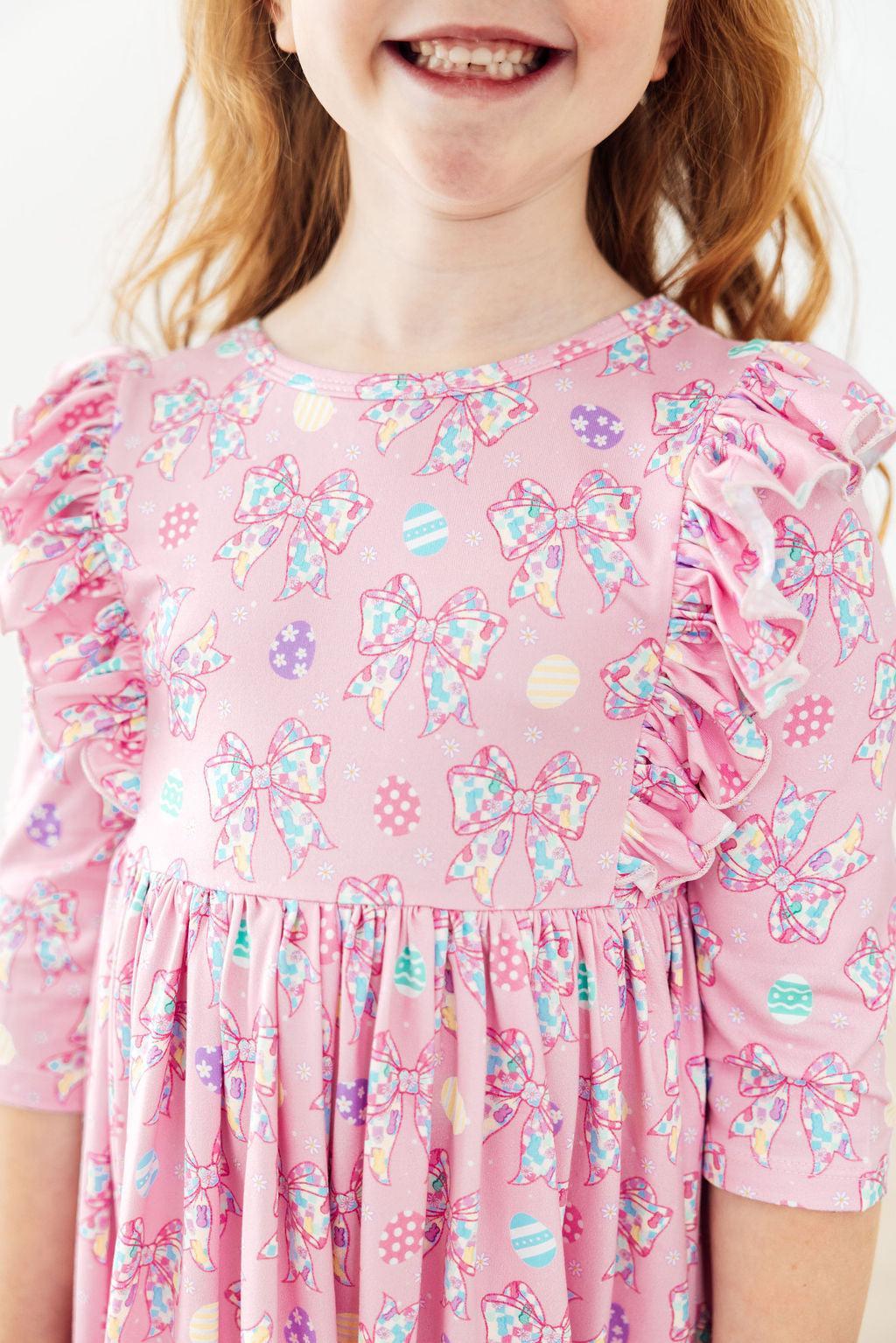 a girl wearing a pink dress