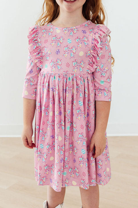 a girl wearing a pink dress