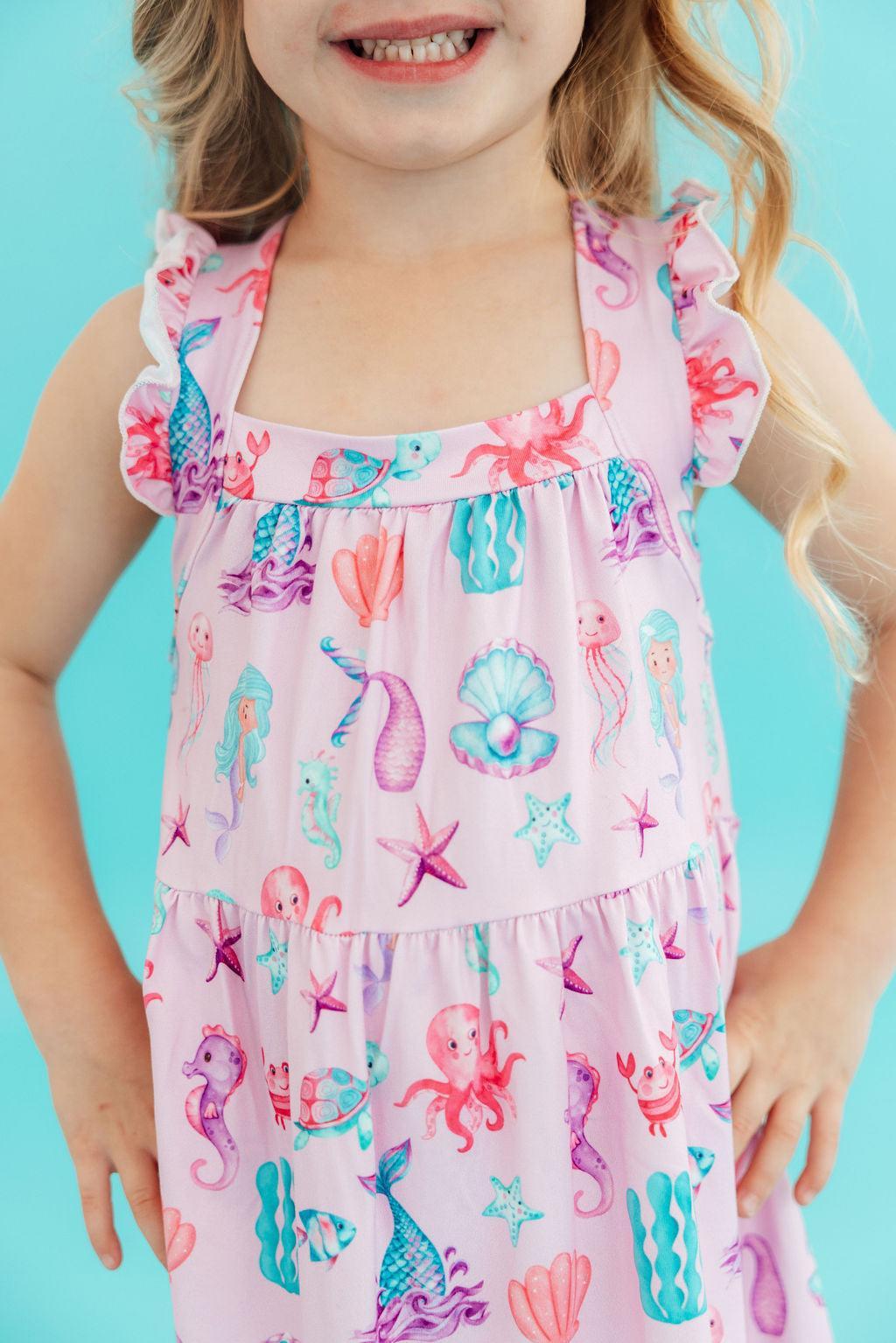 a girl wearing a pink dress
