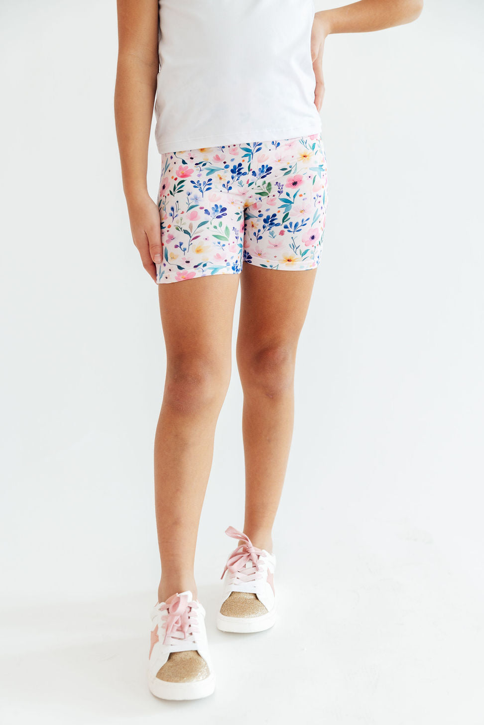 a person wearing shorts and a white shirt