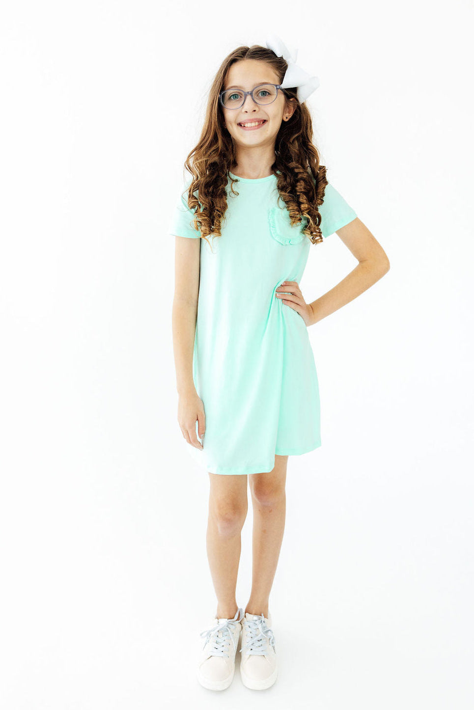 a girl in a light green dress
